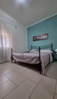 A bed or beds in a room at Terrazza del Santo 2,0 - La Terrazza nel cuore di Napoli