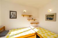 Postel nebo postele na pokoji v ubytování Apartments Jonke