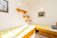 Postel nebo postele na pokoji v ubytování Apartments Jonke