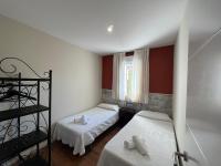 A bed or beds in a room at Complejo la Regalina