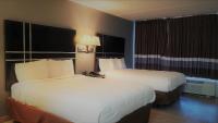 Ein Bett oder Betten in einem Zimmer der Unterkunft South Padre Island Lodge
