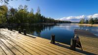 a dock on a lake with a view of the water at Villa Mustikka in Ekenäs