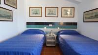 A bed or beds in a room at Miralunga Villetta Gialla