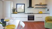 A kitchen or kitchenette at Miralunga Villetta Gialla