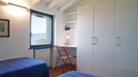 A bed or beds in a room at Miralunga Villetta Gialla
