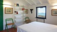 A bed or beds in a room at Miralunga Villetta Gialla
