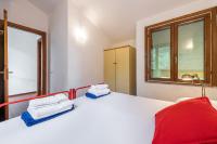 A bed or beds in a room at Domus Carlotta Apartment with sea view Villasimius