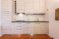 A kitchen or kitchenette at Domus Carlotta Apartment with sea view Villasimius