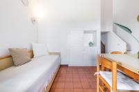 A bed or beds in a room at Domus Carlotta Apartment with sea view Villasimius
