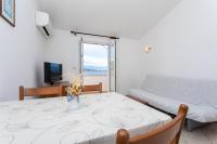Postel nebo postele na pokoji v ubytování Apartments Crnekovic I Zarok