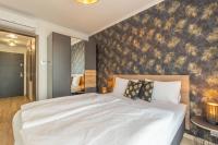 Posteľ alebo postele v izbe v ubytovaní Gold Mandala Apartman Siófok By BLTN