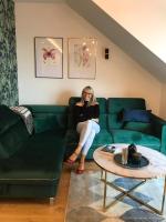 Posedenie v ubytovaní Zielony apartament z widokiem na jezioro