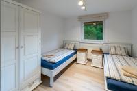 A bed or beds in a room at Chalet Ester - Luxury Provençal House in Orava
