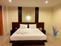 Postel nebo postele na pokoji v ubytování Peak Boutique City Hotel Krabi
