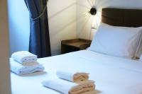 A bed or beds in a room at The Roman Way San Giovanni