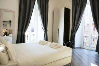 A bed or beds in a room at The Roman Way San Giovanni