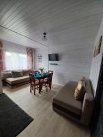 Televízia a/alebo spoločenská miestnosť v ubytovaní OW HOLIDAY Wicie