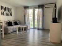 TV a/nebo společenská místnost v ubytování Paradiseresidency