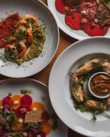 a group of plates of food on a table at Nita Lake Lodge in Whistler