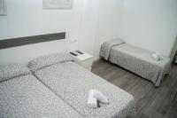 Postel nebo postele na pokoji v ubytování Hostal Goyesco Plaza