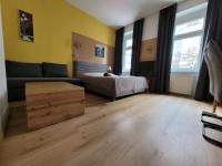 A bed or beds in a room at Leopoldauer Apartment