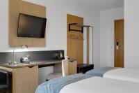 Aurora Hotel at Reykjavik-Keflavik Airport Terminal KEFにあるベッド