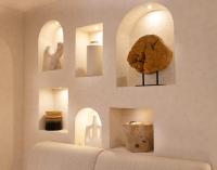 a room with a wall with statues and sculptures on it at Wyndham Residences The Palm in Dubai