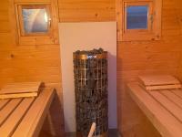a inside of a wooden cabin with two windows at Lovely holiday home in Gouvy with sauna in Gouvy
