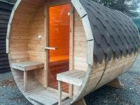 a sauna with two benches in a wooden building at Lovely holiday home in Gouvy with sauna in Gouvy