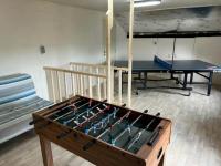a room with a pool table and a bunk bed at Lovely holiday home in Gouvy with sauna in Gouvy