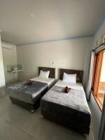Kuta Circle Homestayにあるベッド