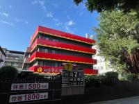 a red and red building with signs in front of it at Taiwan Seven Days Boutique Hotel in Taipei