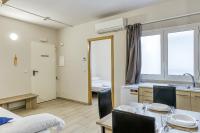 A bed or beds in a room at Giuliano Empuria para 6 personas