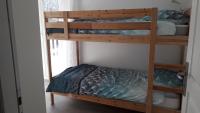 a bunk bed in a room with a bunk bed in a bedroom at GITE LES 3 EDELWEISS - Maison SEGUITTE - 6 PERSONNES in Arette