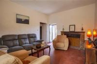 a living room with a couch and a fireplace at Casuccia in Santo-Pietro-di-Tenda