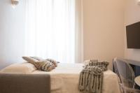 A bed or beds in a room at Vintage Ottaviano Apartment