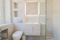 a bathroom with a toilet and a sink and a shower at NAPOLEON Luxurious renovated apartment 1min from Palais in Cannes