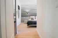 a hallway with a bed in a room at NAPOLEON Luxurious renovated apartment 1min from Palais in Cannes
