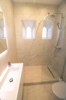 a bathroom with a shower with a toilet and a sink at NAPOLEON Luxurious renovated apartment 1min from Palais in Cannes