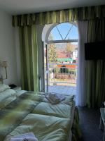 Postel nebo postele na pokoji v ubytování Hotel Ferdinand