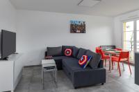 a living room with a couch and a table at T2 Marvel Apartment Near DisneylandParis in Serris
