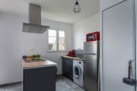 a kitchen with a refrigerator and a washing machine at T2 Marvel Apartment Near DisneylandParis in Serris