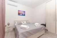 Postel nebo postele na pokoji v ubytování Apartments Silvana