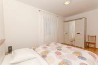 Postel nebo postele na pokoji v ubytování Apartments Silvana