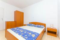 Posteľ alebo postele v izbe v ubytovaní Apartments Kazimir