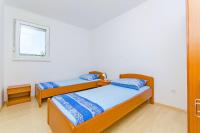 Posteľ alebo postele v izbe v ubytovaní Apartments Kazimir