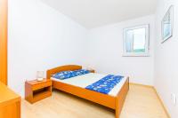 Posteľ alebo postele v izbe v ubytovaní Apartments Kazimir