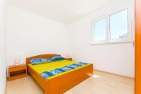 Posteľ alebo postele v izbe v ubytovaní Apartments Kazimir