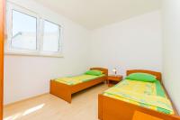 Posteľ alebo postele v izbe v ubytovaní Apartments Kazimir