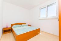 Posteľ alebo postele v izbe v ubytovaní Apartments Kazimir